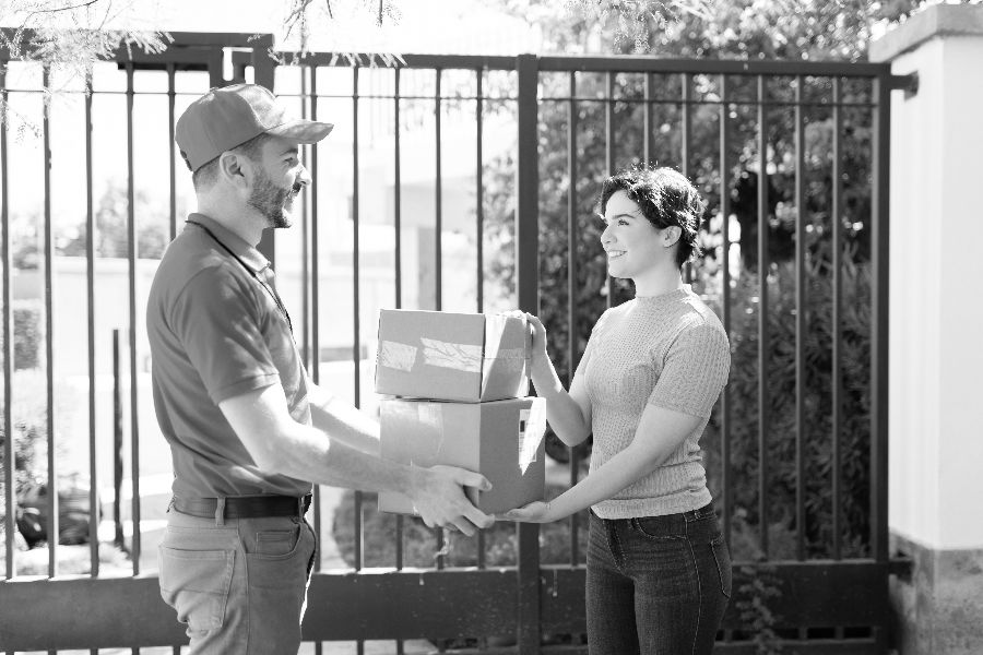 Courier Giving a Package to a customer